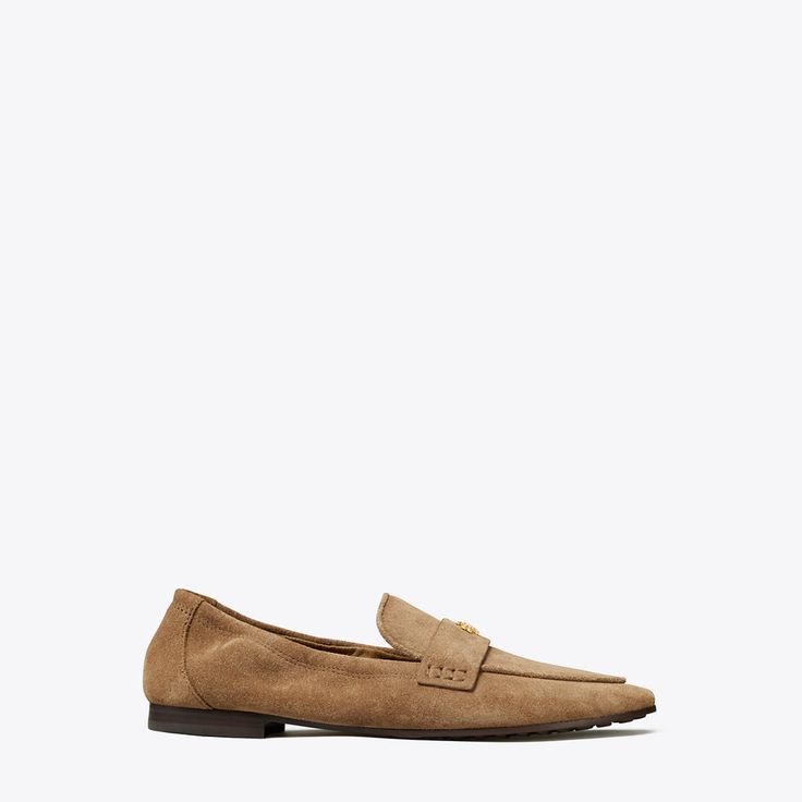 Our Ballet Loafer® is an interpretation of two classics — the flexibility of a ballet slipper with the profile of a loafer. The insole provides performance-level comfort, ruched sides secure the foot and treads on the outsole add traction. It is crafted in suede and detailed with a Double T in brushed gold. The shoe's edges are hand-painted and the strap is hand-stitched.  Crafted in partnership with a Leather Working Group-certified tannery, supporting high standards in leather manufacturing an Classic Slip-on Ballet Flats With Textured Sole, Classic Slip-on Ballet Flats For Formal Occasions, Classic Slip-on Calf Leather Ballet Flats, Classic Slip-ons With Flat Heel, Classic Slip-on Calf Leather Flats, Classic Flat Loafers With Stitched Sole, Spring Calf Leather Loafers With Almond Toe, Classic Calf Leather Slip-on Flats, Classic Formal Slip-on Ballet Flats