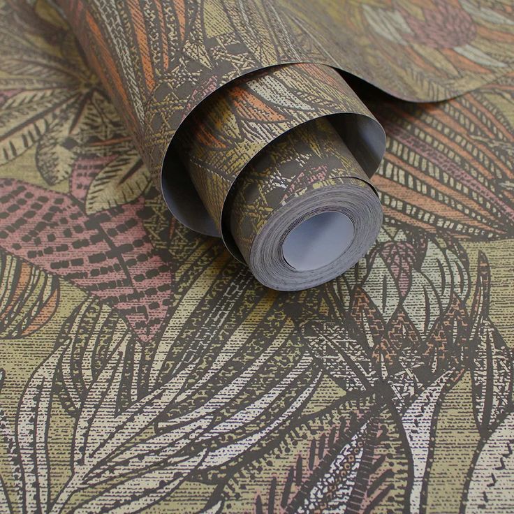 a roll of wallpaper with an intricate design on it