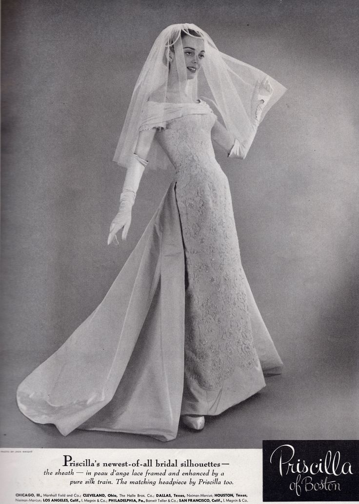 an old fashion photo of a woman in a wedding dress with veil on her head