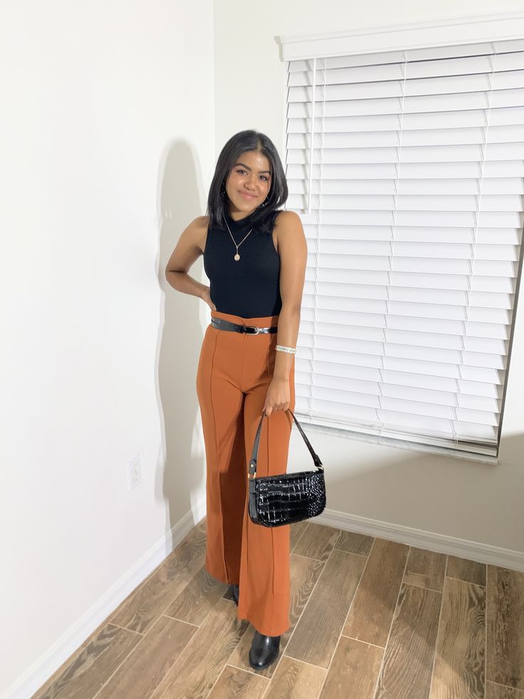 Burnt Orange Leather Pants Outfit, Orange Work Pants Outfit, Burnt Orange And Black Outfit, Burnt Orange Wide Leg Pants Outfit, Orange And Black Outfit Aesthetic, Ulta Work Outfit, Orange Wide Leg Pants Outfit, Orange Pants Outfit Work, Burnt Orange Pants Outfit