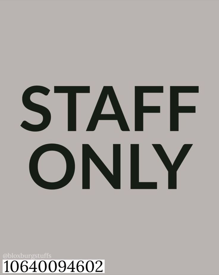 the words staff only are in black on a gray background