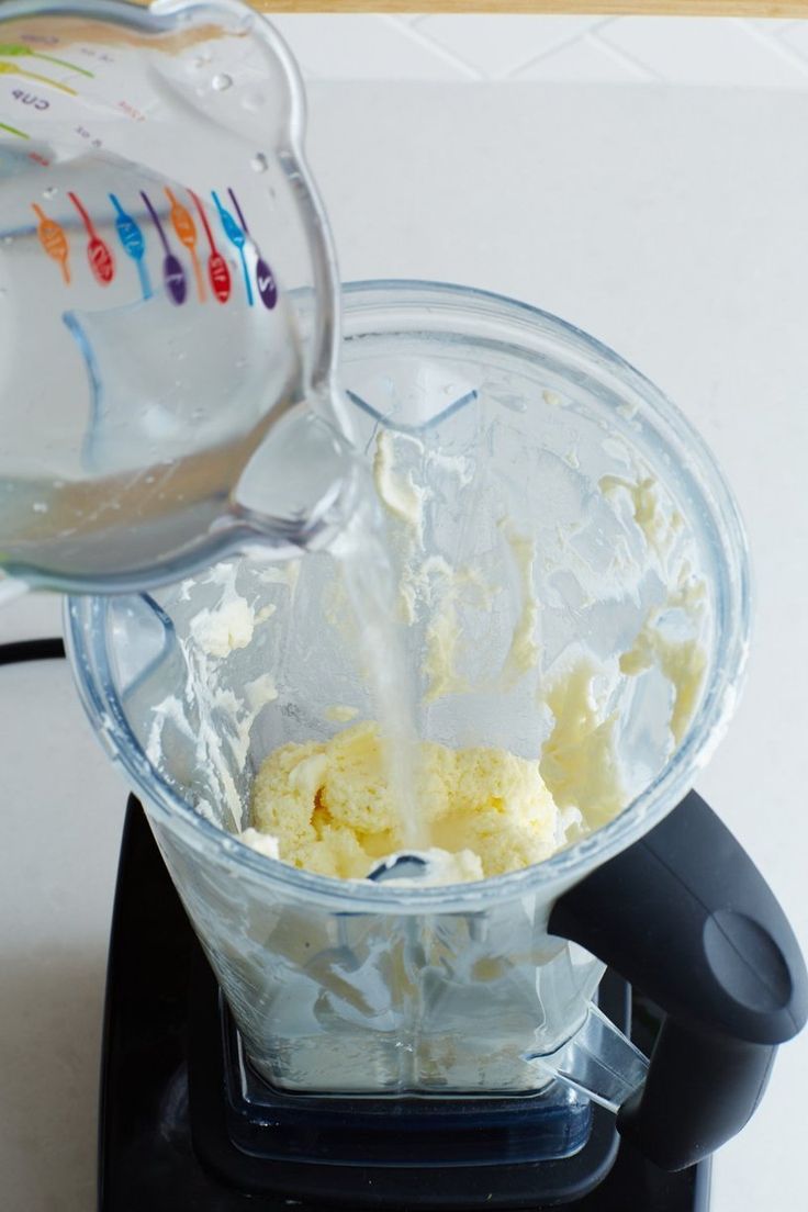 a blender filled with ice cream sitting on top of a counter