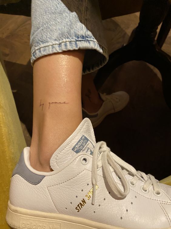 a woman's foot with a tattoo on her left ankle and the word i love you written on it