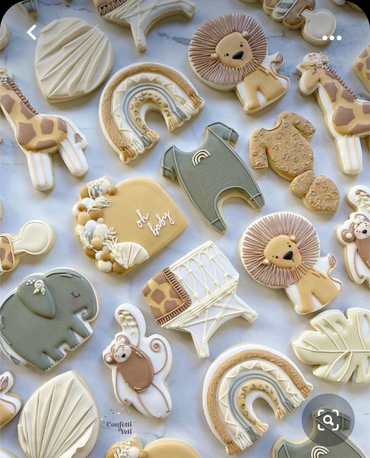 many decorated cookies are laying on a table