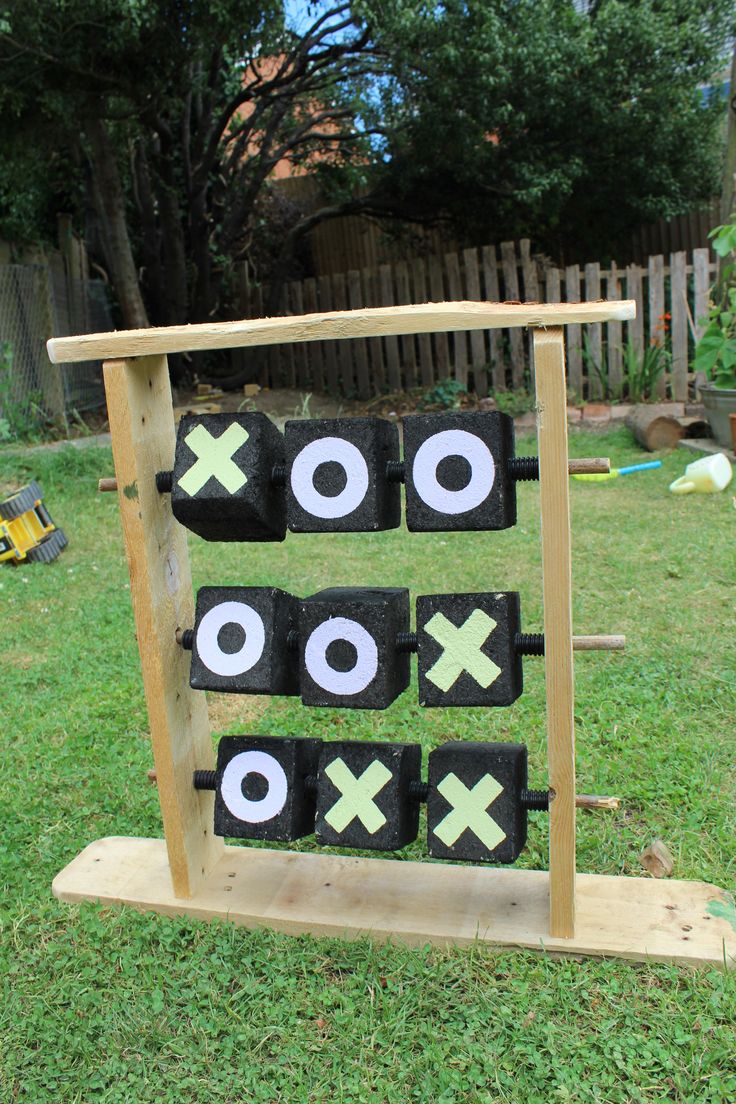 an outdoor tic - tac - toe game in the yard