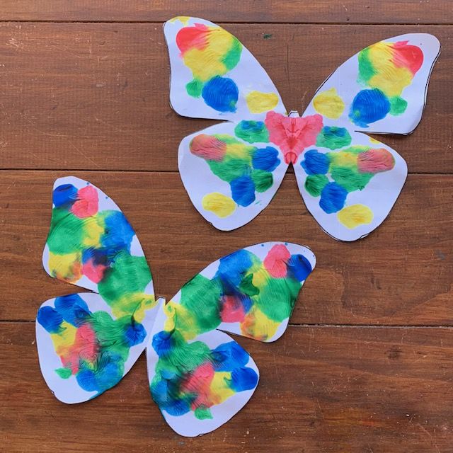 paper plate butterfly craft for kids to make with colored tissue paper and glue on the wings