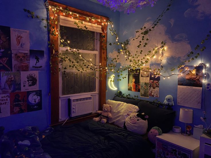 a bedroom decorated for halloween with lights strung from the ceiling and decorations on the walls