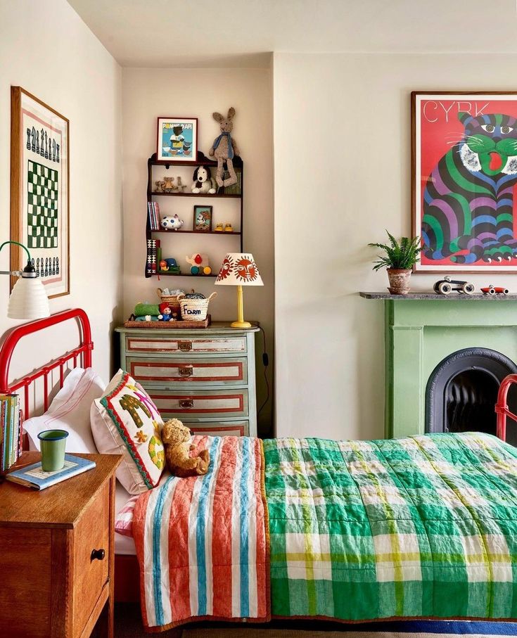 a bed room with a neatly made bed and a painting on the wall