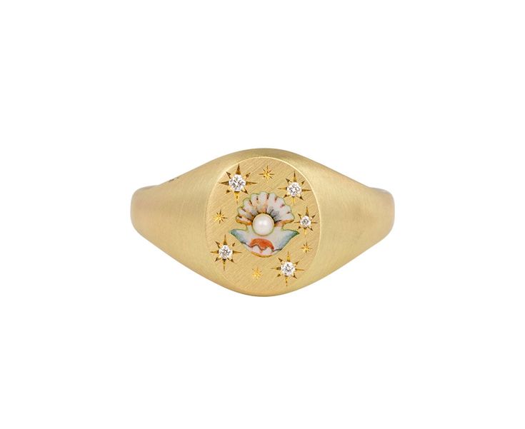 With its stunning details and subtle sparkle, this Cece Jewelry ring is a sweetly feminine take on the traditional signet ring. The matte 18K yellow gold oval ring face has been delicately painted with a tiny Champlevé enamel clam shell and set with five tiny star set diamonds. A small white pearl sits at the center of the clam adding the perfect touch of whimsy. The composition is set at the center of the matte 18K yellow gold band. 18K yellow gold and enamel ring face : just under 1/2" x 3/8"d Clam And Pearl, Gold Oval Ring, Digby And Iona, Rebecca Overmann, Rings Rings, Tiny Star, Oval Ring, Oval Rings, Clam Shell