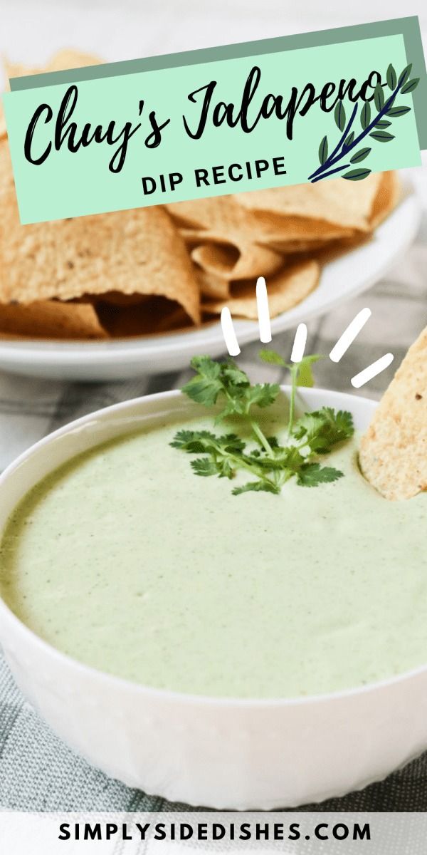 a white bowl filled with dip and tortilla chips on top of a table