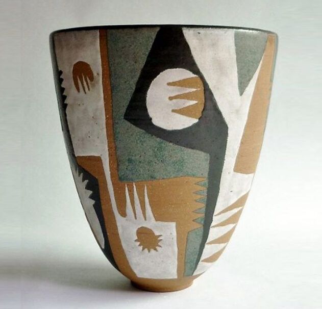 a ceramic vase with abstract designs on it