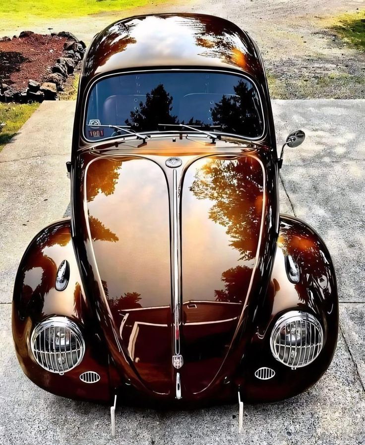 an antique car is parked on the side of the road