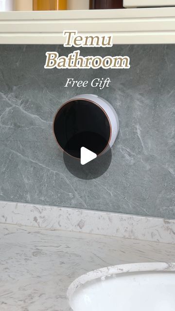 there is a bathroom sink with a free gift sign on it