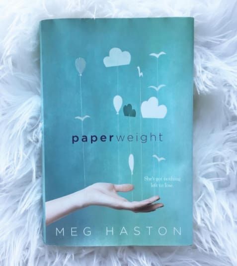 a copy of the book paperweight by meagan is on sale for $ 25