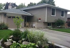 a house with landscaping in front of it