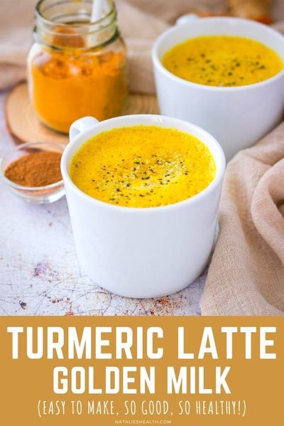 two white bowls filled with golden milk and topped with cinnamon sprinkles, next to a jar of turmericate golden milk