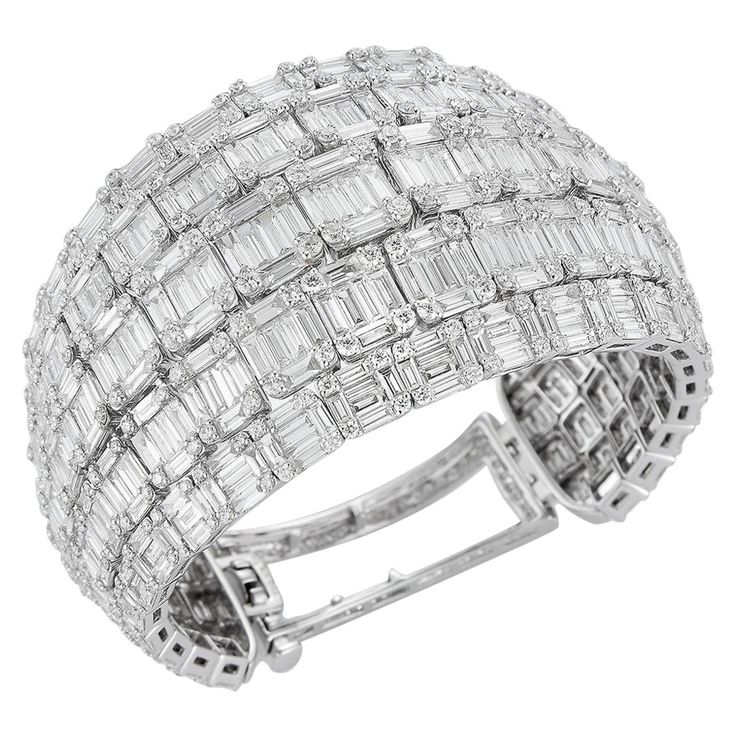 Breathtaking 18K White Gold Bangle Bracelet in a unique Cuff-Style with 5 Rows of 550 White Round Diamonds totaling 5.31 Carats & 662 Dazzling Baguette Diamonds totaling 33.01 Carats. Bling Ideas, White Gold Bangle, Antique Bracelets, Vintage Bangles, Baguette Diamonds, Expensive Jewelry, Gold Bangle Bracelet, Gold Bangle, Diamond Bangle