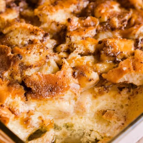 a close up of a casserole dish with cheese and meat toppings on it