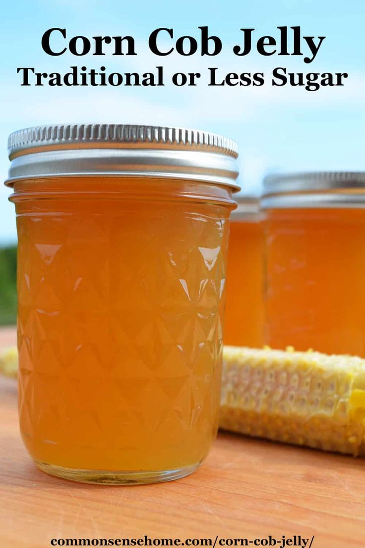 corn cob jelly in a mason jar on a table with the text corn cob jelly traditional or less sugar