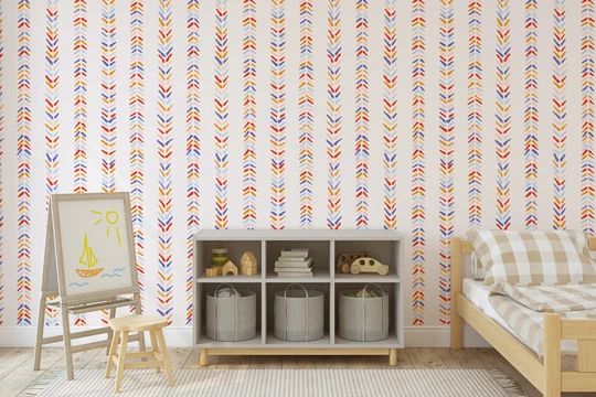 a child's room with colorful wallpaper and furniture