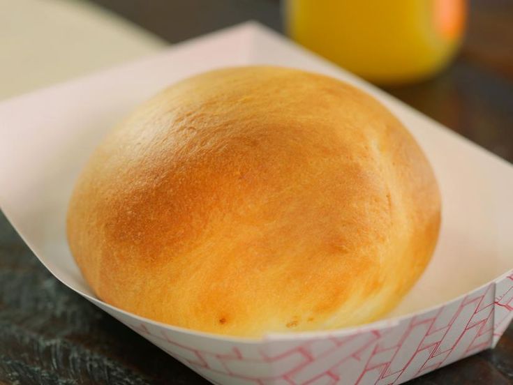 a close up of a bread in a paper container