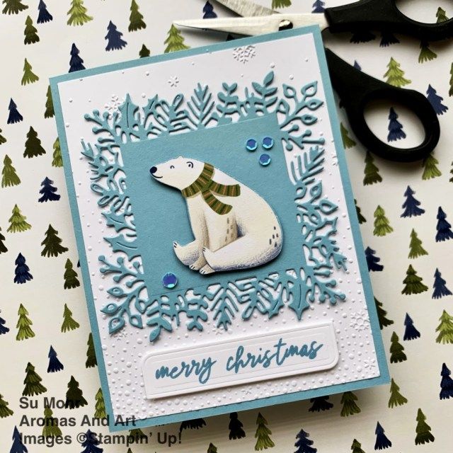 a polar bear christmas card with scissors and paper