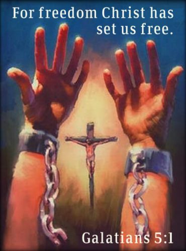 two hands are chained to a cross with chains