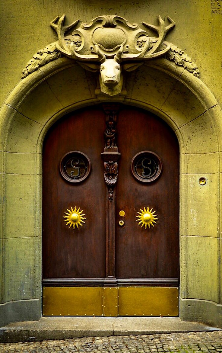 two wooden doors with ornate carvings on them