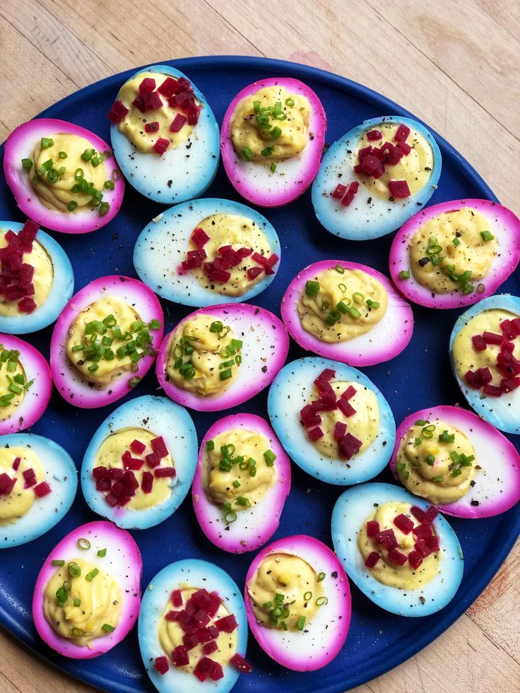 deviled eggs are arranged on a blue plate