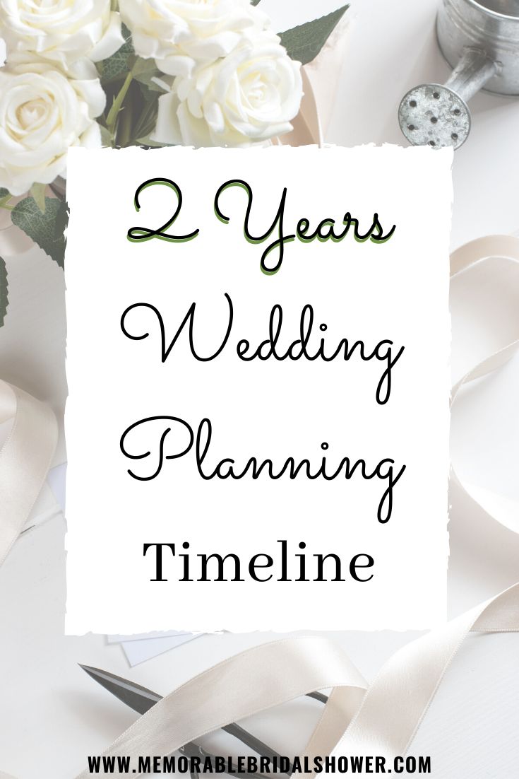 two years wedding planning time line with flowers and ribbon on the table next to it