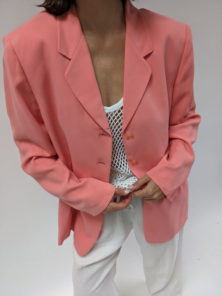 Stunning bubblegum pink blazer in a soft and lightweight silk. The blazer features a notched collar, front button closures, and side pockets at the front seams. Tag reads Linda Allard Ellen Tracy Faint watermark at the front lapel, dime-size discoloration at the bottom left hem and a couple tiny picks to the silk at the shoulder. Classic Pink Blazer With Hidden Buttons, Classic Pink Blazer With Hidden Button Closure, Tailored Pink Blazer With Hidden Button Closure, Pink Notch Lapel Blazer With Hidden Button Closure, Pink Blazer With Notch Lapel And Hidden Buttons, Pink Formal Blazer With Hidden Buttons, Formal Pink Blazer With Hidden Buttons, Formal Pink Blazer With Hidden Button Closure, Single Breasted V-neck Blazer In Solid Color