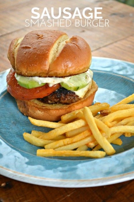 a hamburger and french fries on a blue plate