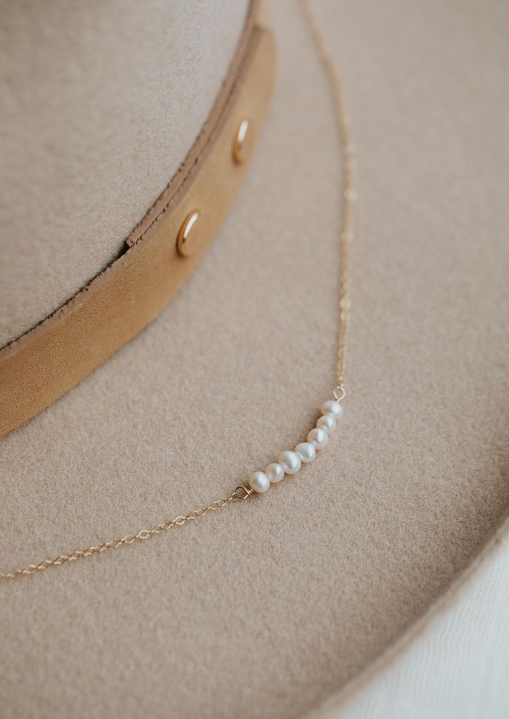 We’re in our Pearl Era, so naturally we made a pearl version of our Linked Necklace. Instead of chain links, let each of these pearls symbolize something special in your life. Use it as a daily reminder to count your blessings. 2-7 pearls are attached to 15" our delicate cable chain with a 1" extender. Available in 14kt Gold Fill + Sterling Silver. Claire layers it with our Nash Lariat Necklace. KJ layers it with our Evermore Necklace and Herra Chain. Handmade in Eau Claire, WI. Our jewelry is h Poppy Ring, Copper Uses, Everyday Wear Jewelry, Count Your Blessings, Chain Links, Heart Studs, Lariat Necklace, Jewelry Cleaner, Jewelry Case