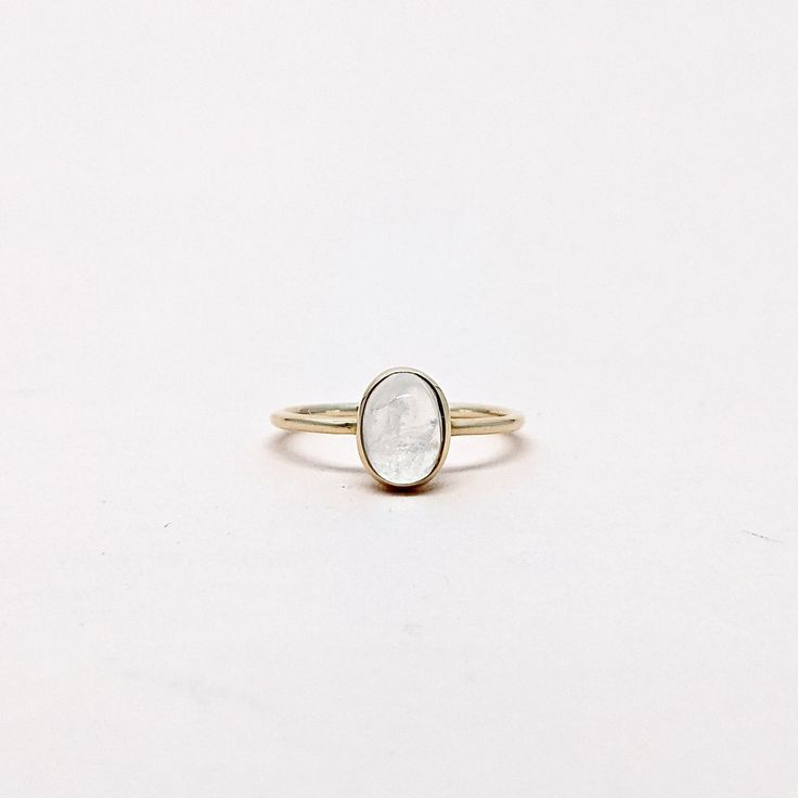 Natural Rainbow Moonstone Oval Cabochon Gemstone Stackable Ring. Semi Precious Gemstone Ring in 14k SOLID GOLD For Her from our Capsule Jewelry Collection.RainBow Moonstone is set in Bezel Setting in our Factory. Gold Ring AAA+ Quality. Perfect Gift For Everyday or June Birthstone Gift for Your Loved Ones. ►  DIMENSIONS : ◆ Gemstone : Rainbow Moonstone 0.60ct ◆ Stone size : 6*8 mm ◆ Shank Width : 1 mm      ◆  Material :  14k Yellow Gold      EACH Ring is Stamped With 585 Marked As 14k GOLD International Standard. All my gemstones are hand-selected for best quality assurance, then precisely sawed, and shaped into the desired geometry. The precious stones are then delicately grinned, sanded, and hand-polished to make sure each Ring has the perfect aesthetic. * Contact us For Resizing and Per Gold Moonstone Stackable Jewelry, Gold Moonstone Ring Fine Jewelry With Birthstone, Gold Moonstone Gemstone Ring For Anniversary, Minimalist 14k Gold Oval Cabochon Jewelry, Heirloom Gold Moonstone Jewelry, Minimalist Oval Cabochon Wedding Jewelry, Yellow Gold Moonstone Oval Cabochon Ring Gift, Fine Jewelry Stackable Oval Rings, Delicate Gemstone Open Ring Jewelry