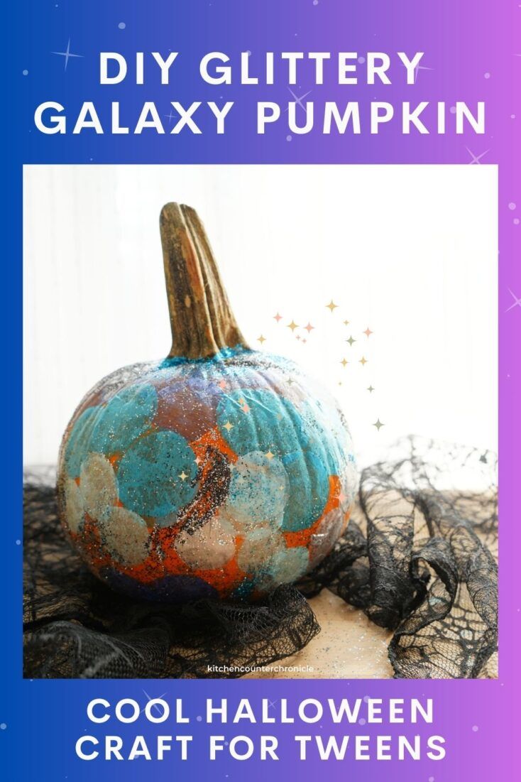 a blue and orange pumpkin sitting on top of a table