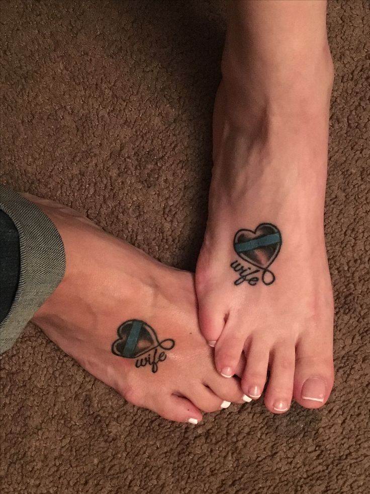 two people with matching tattoos on their feet