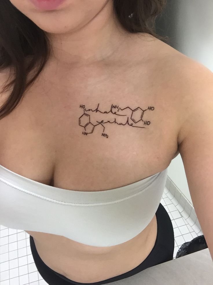 a woman with a tattoo on her chest