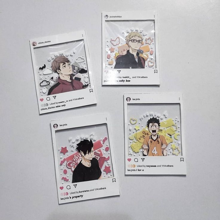 four cards with anime characters on them sitting on a white counter top next to each other