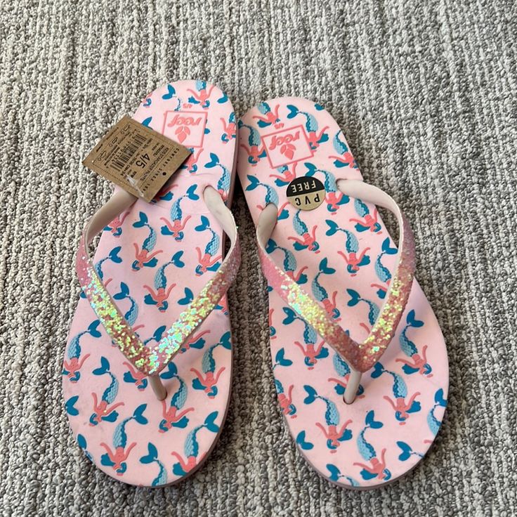 Open Toe Slip On Style Perfect For Water Mermaid Print On Sole Synthetic Sole These Run Small, Size Up Kids 4/5 Pink Synthetic Beach Slippers, Pink Synthetic Slippers For The Beach, Cute Non-slip Flip Flops For Swimming, Playful Slip-on Flip Flops For The Beach, Playful Synthetic Flip Flops For Beach, Non-slip Playful Flat Flip Flops, Playful Non-slip Flat Flip Flops, Pink Cushioned Flip Flops For The Beach, Pink Vacation Slippers With Cushioned Footbed