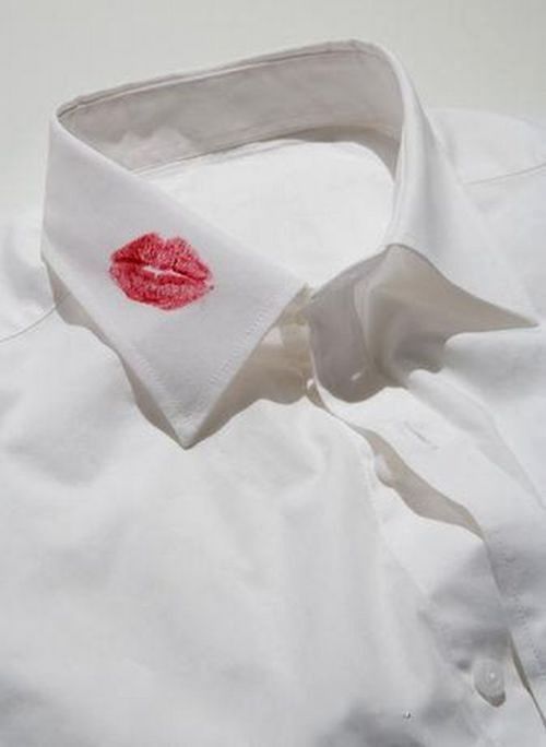 a white shirt with red lips on it