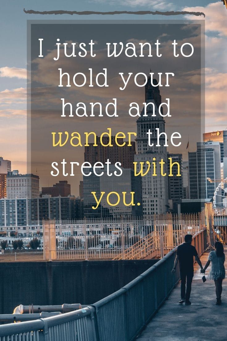 two people walking across a bridge with the words i just want to hold your hand and wonder