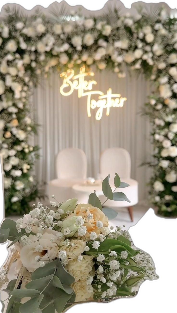 a bouquet of flowers sitting in front of a mirror