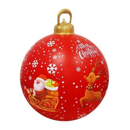 a red christmas ornament with santa and reindeers on it's side