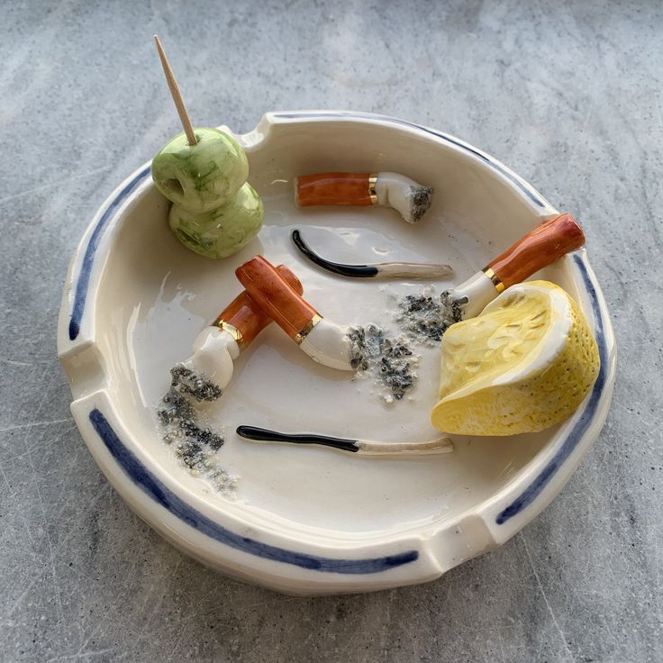 a white plate topped with different types of food on top of a gray countertop