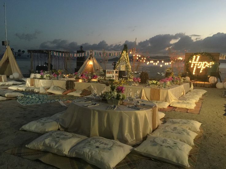 a table set up on the beach for a party