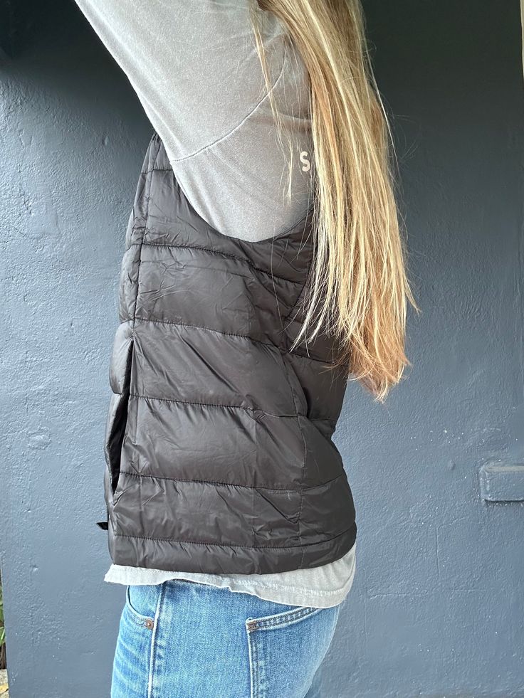 Stay toasty and on trend with the Beacon 2 Vest! This ultra-cozy puff vest has a high-neck design and a storage pouch for all your essentials. Keep warm and snug whether you’re out and about or just lounging around. Feeling fly has never been so easy! Cold Weather Sleeveless Nylon Vest, Sleeveless Nylon Vest For Cold Weather, Casual Sleeveless Everyday Outerwear, Cold Weather Puffer Vest, Black Puffer Vest For Outdoor, Urban Winter Vest For Outdoor Activities, Functional Vest For Outdoor Activities In Fall, Casual Outdoor Vest Outerwear, Functional Sleeveless Vest For Cold Weather