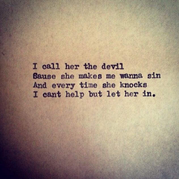 an old typewriter with the words i call her the devil cause she makes me wanna sin and every time she knocks i can't help but let her in