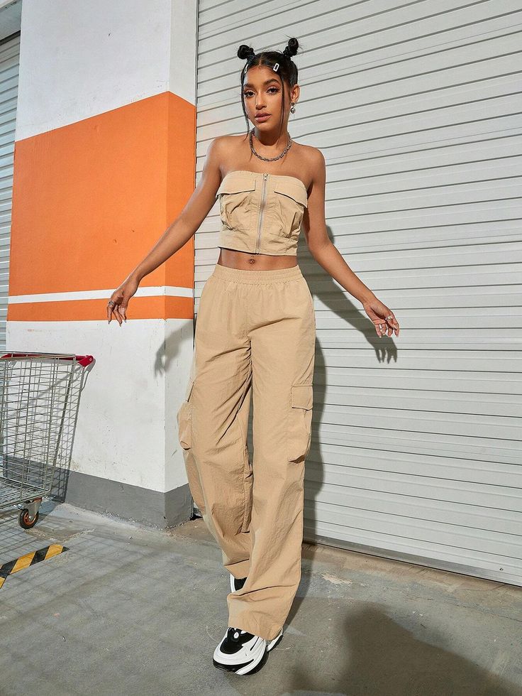 Our Tube Top And Flap Pocket Wide Leg Cargo Pants will give your everyday wardrobe a major upgrade. When it comes to style, these beige pants have you covered. With multiple pockets for pocket flaps, you’ll never be without a place to store your goodies. Whether you're on the go or kicking back, you'll be doing it in style. So step out boldly and watch those heads turn. Specifications: Style: Casual Pattern Type: Plain Details: Pocket, Ruched Bust Neckline: Strapless Top Type: Bandeau Bottom Typ High Waist Beige Cargo Pants With Side Pockets, Beige High-waist Cargo Pants With Side Pockets, Beige High-waisted Parachute Pants With Pockets, Beige High-waisted Cargo Pants, High-waist Beige Parachute Pants With Side Pockets, Beige High Waist Parachute Pants With Side Pockets, Beige High-waisted Cargo Parachute Pants, High Waist Beige Cargo Pants With Cargo Pockets, High Waist Beige Cargo Pants