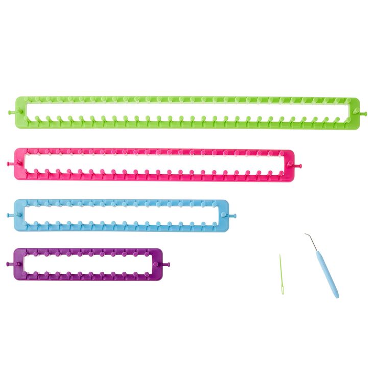 four different colored plastic combs with scissors