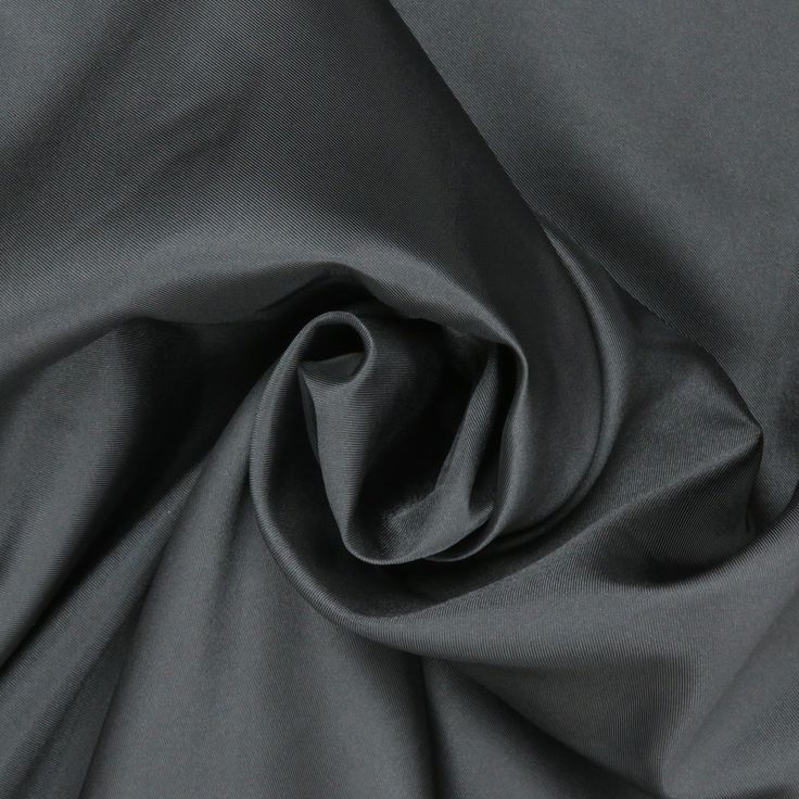 Elevate your creations with our exquisite Black Solid Mikado fabric. Renowned for its luxurious sheen and structured finish, Mikado is a blend of silk and nylon that offers both elegance and versatility. The deep, rich black hue adds an element of sophistication to any garment, making it a popular choice for eveningwear, bridal gowns, and formal attire. This fabric's substantial weight and crisp texture provide the perfect drape, ensuring that your designs maintain their shape and elegance throu Elegant Silk Fabric For Evening, Elegant Evening Silk Fabric, Fitted Silk Fabric For Party, Elegant Silk Fabric For Formal Occasion, Elegant Silk Fabric With Satin Finish, Elegant Black Party Fabric, Fitted Solid Color Fabric For Formal Occasions, Fitted Solid Fabric For Formal Wear, Formal Solid Fitted Fabric